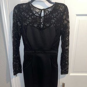 BCX Black lace long sleeve tight fitting dress. Size small.
